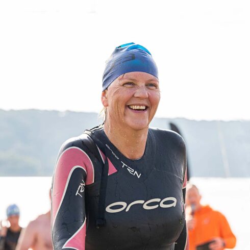 Woman Exiting the Water after Open Water Swim